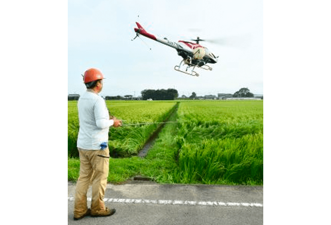 高品質な米生産のために行われる無人ヘリでの防除作業